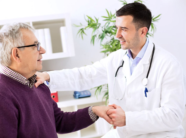 Physician evaluating shoulder and arm discomfort during a chronic pain treatment consultation