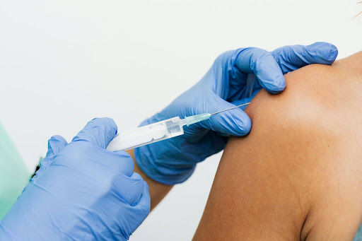 Close-up of prolotherapy injection being given in the shoulder
